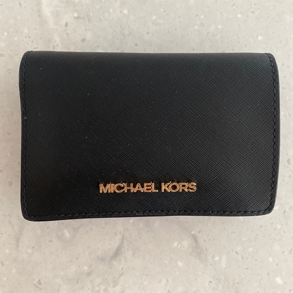 Michael Kors wallet. No flaws. Black with gold lettering.